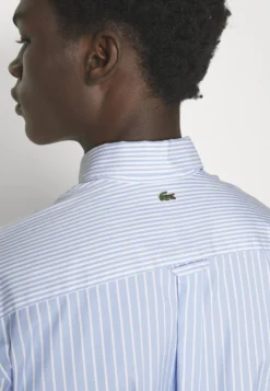Lacoste Unisex - Overhemd - White/Hellblau -Lacoste 0b505b826d6e4290b7a5f6d0a58802f3 scaled