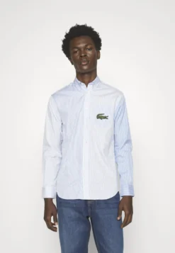 Lacoste Unisex - Overhemd - White/Hellblau -Lacoste 0be633866ddf4134901c4e15d8a9eb4b scaled