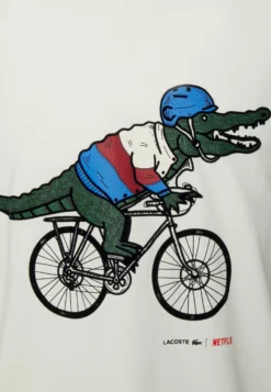 Lacoste X Netflix - T-Shirt Print - Flour -Lacoste 1bab3b8953474ac1859479725625d568 scaled