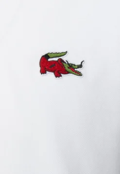 Lacoste X Netflix - Poloshirt - White 10 Lacoste X Netflix - Poloshirt - White -Lacoste 93aa0c27997c4b88be775b1b0190a585 scaled