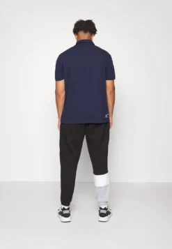 Lacoste Trainingsbroek - Noir/Blanc -Lacoste b9a69fccf2d1478583ee5410d672ecce scaled