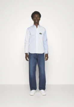 Lacoste Unisex - Overhemd - White/Hellblau -Lacoste c4cc371815b14bf5aa5956d88c5d0bad scaled